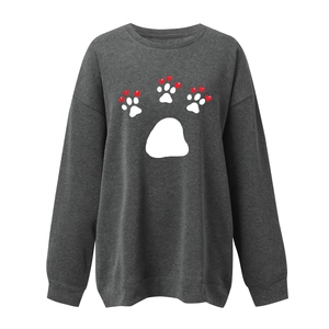 Detail view of dark grey sweatshirt featuring white paw print and red heart design