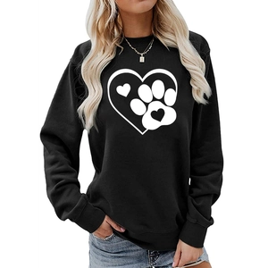 Detail of a black crewneck sweatshirt featuring white heart and paw print graphic design