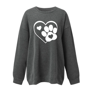 Detail of soft charcoal grey fabric with a white heart and dog paw print pattern