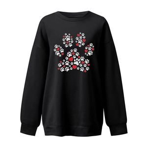Detail of the heart and paw print graphic on this casual black crewneck sweatshirt