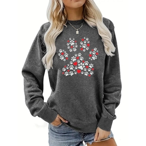 Detailed close-up of heart and paw print pattern on dark grey crewneck sweatshirt