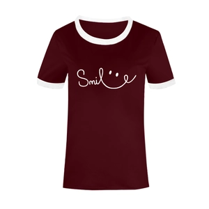 Detail of burgundy T-shirt with white contrast piping and Smile graphic print