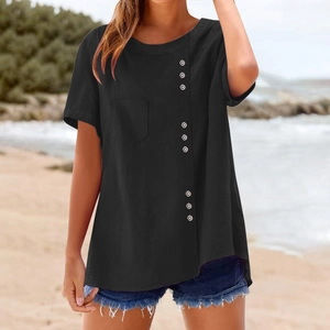 Close-up of black cotton-linen T-shirt featuring a single chest pocket and decorative buttons