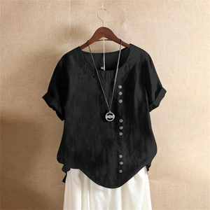Detail of black cotton linen t-shirt featuring decorative side buttons and front chest pocket