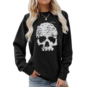 Close-up of the artistic white skull print on a black crewneck sweatshirt for women