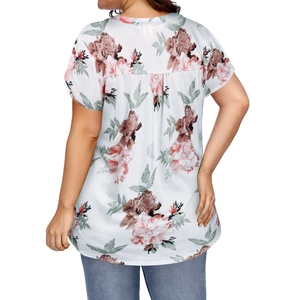 Rear view of floral short sleeve top showing pleated back detail and loose fit