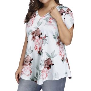 Close-up of V-neckline and floral print on a white loose-fit summer blouse for women