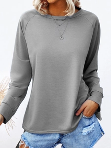Women's casual grey crewneck long sleeve t-shirt with elegant raglan sleeves and rib cuffs