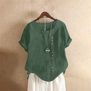Detail of dark green cotton linen shirt with vintage buttons and side pocket texture
