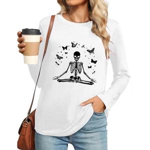 Close-up of skeleton meditation print with butterflies on white long sleeve shirt