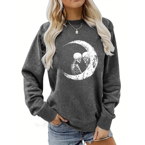 Detail view of charcoal grey sweatshirt featuring moon and skulls graphic print on the front