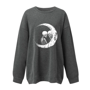 Detail of loose-fit sweatshirt featuring skeleton graphic under moon silhouette print