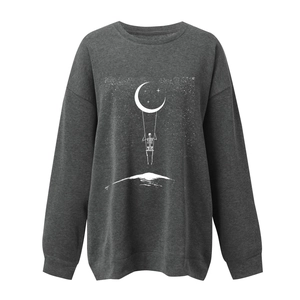 Close-up of skeleton on moon print detail on dark gray long sleeve sweatshirt