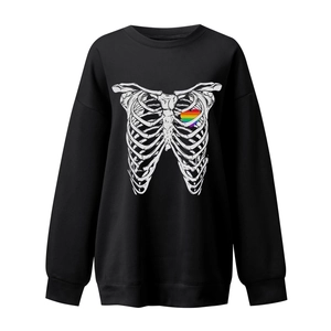 Detail of skull ribcage print with rainbow heart on black oversized crewneck sweatshirt