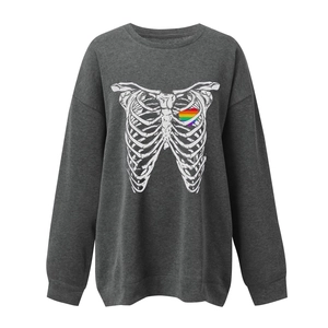 Detail of rib cage print with a rainbow heart on dark charcoal grey sweatshirt fabric