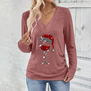 Detail of wooden buttons on a vintage pink Christmas wine glass print V-neck shirt