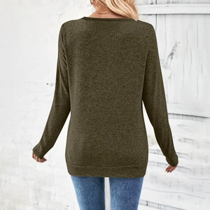 Detail view of olive green V-neck long sleeve top with textured melange knit fabric