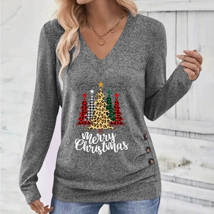 Detail of Christmas tree print and decorative buttons on a grey V-neck long sleeve top
