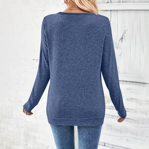 Detailed back view of a heathered blue long sleeve shirt with knit texture
