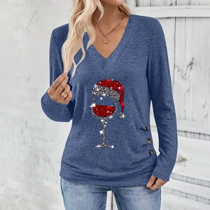 Close-up of V-neck top with Christmas wine glass glitter print and button side detail