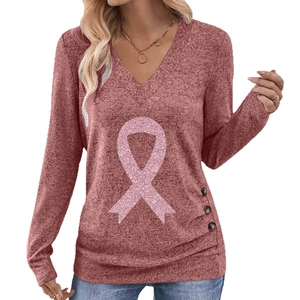 Dusty pink V-neck long sleeve top with pink ribbon print and decorative buttons