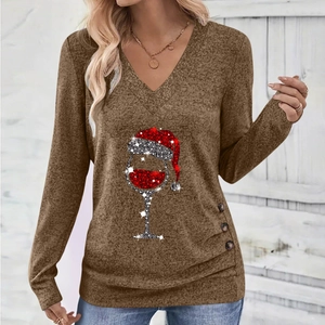 Detail of V-neck top with Christmas wine glass print and decorative buttons on side