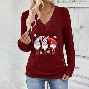Close-up of V-neckline with Christmas gnomes print and side button details on burgundy top