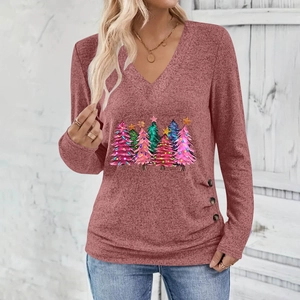 Close-up of V-neck Christmas tree print top with button detail and knit texture