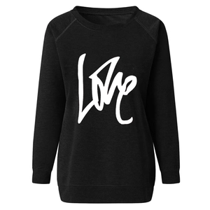 Detail of black raglan sleeve sweatshirt with white LOVE cursive print on chest