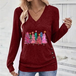 Detail view of the elegant V-neckline and decorative buttons on the wine red Christmas top