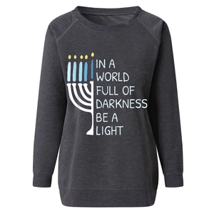 Detail of Hanukkah Menorah print with 'Be a Light' text on charcoal grey sweatshirt