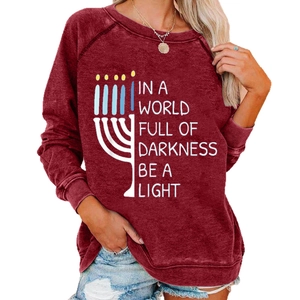 Women's burgundy Hanukkah sweatshirt with Menorah print and Be A Light slogan