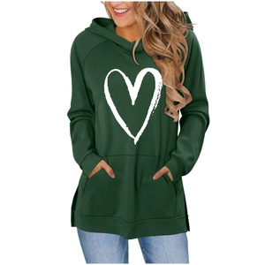 Detail view of dark green hoodie featuring white heart print and kangaroo pocket
