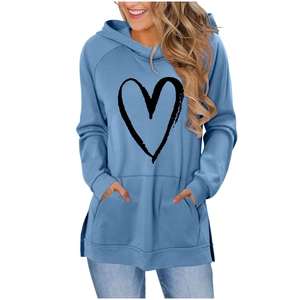 Detailed view of light blue heart print hoodie featuring raglan sleeves and side slits