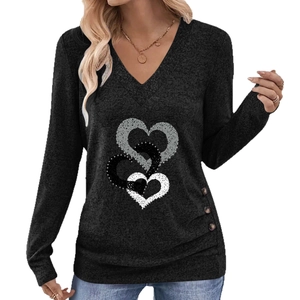 Elegant black V-neck long sleeve top with heart print and side buttons detail
