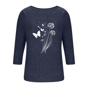 Detail of navy knit top featuring textured vertical ribs and white dandelion butterfly print