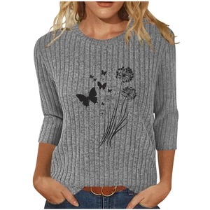 Close-up of grey ribbed knit T-shirt with black dandelion and butterfly print detail