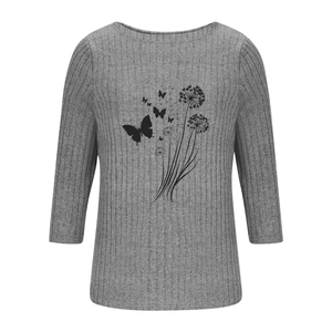 Close-up of grey ribbed knit texture with butterfly and dandelion graphic print