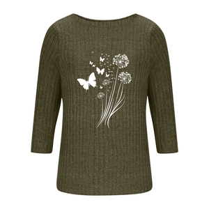 Close-up of olive green ribbed knit T-shirt featuring white dandelion and butterfly prints