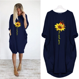 Navy blue summer dress with sunflower and butterfly print featuring large side pockets