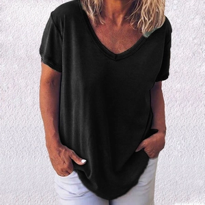 Detail of a casual black V-neck short sleeve t-shirt in a loose fit for summer wear