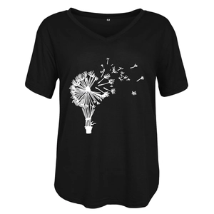 Close-up of black V-neck T-shirt showing dandelion print and soft cotton fabric texture