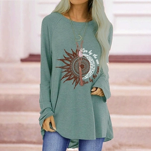 Detail of bohemian sun and moon mandala print on sage green long sleeve t-shirt