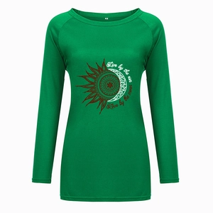 Detail of teal long sleeve t-shirt showing the sun and moon mandala print and crew neckline