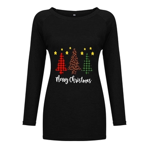 Close-up of leopard and plaid Christmas tree prints on a black long sleeve tee