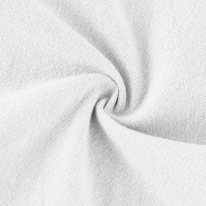 Close-up of white cotton linen fabric showing high-quality woven texture and soft material