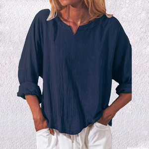 Close-up of women's loose V-neck cotton linen shirt in deep navy blue color