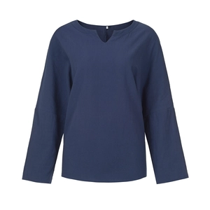 Close-up detail of the V-neckline and size M label on dark blue cotton linen shirt