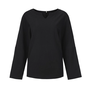 Close-up of black cotton linen long sleeve shirt with a V-neckline and textured fabric
