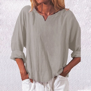 Close-up of linen texture on grey-brown V-neck loose long sleeve shirt for women